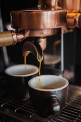 espresso machine pouring coffee into cup