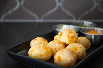 Cheese Bread served in a restaurant. 

Brazilian snack cheese bread - Traditional Brazilian food.