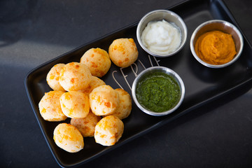 Cheese Bread served in a restaurant. 

Brazilian snack cheese bread - Traditional Brazilian food.