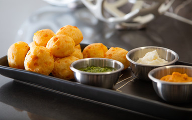 Cheese Bread served in a restaurant. 

Brazilian snack cheese bread - Traditional Brazilian food.