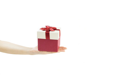 Hand holding gift red box on white background