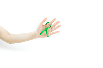 Hand holding green ribbon bow isolated on white background. Kidneys cancer .healthcare and medicine concept
