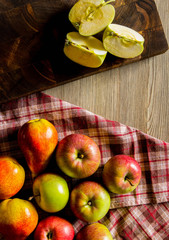 Apples and pears wrapped in a plaid cloth 