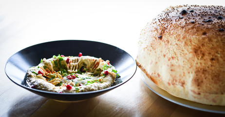 delicious home made lebanese hummus with fresh pomegranate seeds