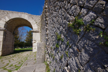 Fototapeta na wymiar One of the four entrance doors to the archaeological site of Altilia. Sepino - Molise - Italy