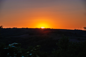 Sunset in Vojvodina in Serbia, near the mountain of Fruska Gora. Sunset over mountains