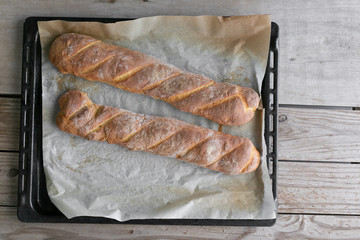 Homemade bread on a wooden backround