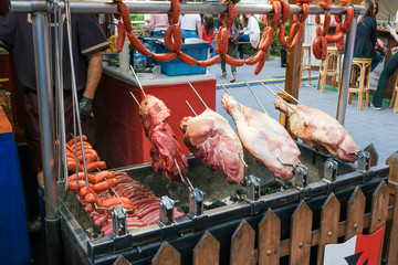 Preparing grilled meats in the market