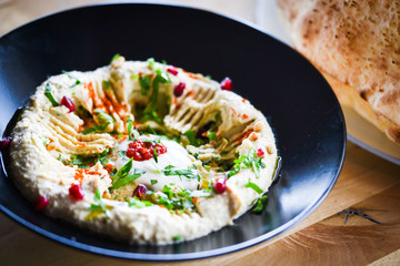 delicious home made lebanese hummus with fresh pomegranate seeds