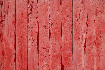 Cracked Light red wood background. Timber vertical plank, scratched surface. Pink wooden fence background. Copy space. Vintage texture boards.