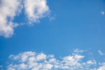 Naklejka na ściany i meble Blue sky with white clouds, background