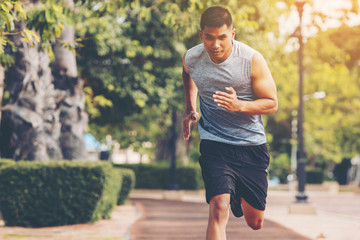 Runners. Young people  running on a city path
