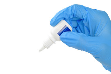 Human hand in medical glove is using medicine or eye drop isolated on white background with clipping path.