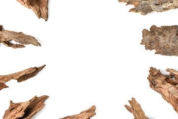 Driftwood or aged wood arrange in a circle isolated on white background.