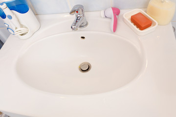 Fototapeta premium bathroom sink tap, soap bar and liquid