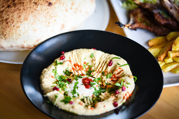 delicious home made lebanese hummus with fresh pomegranate seeds