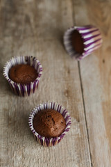 Mini cakes on a wooden background 