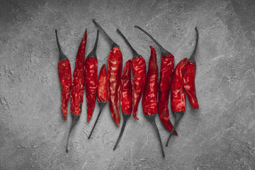 Red hot pepper on a concrete background. close up