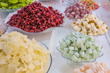 Selling sweet dried fruits in the market