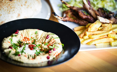 delicious home made lebanese hummus with fresh pomegranate seeds