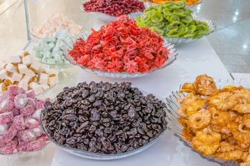 Selling sweet dried fruits in the market