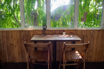 Tables and chairs with an atmosphere in a coffee shop in Thailand.