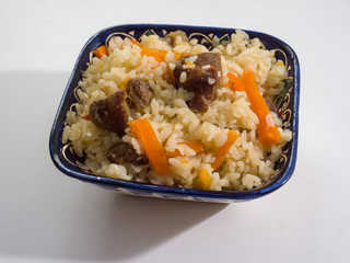 Pilaf in a national oriental bowl. Asian traditional dish