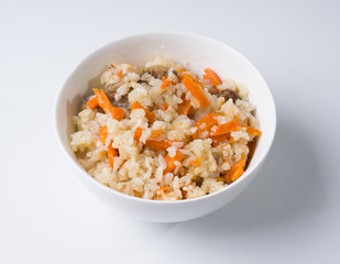 Pilaf in a round white bowl. Asian traditional dish