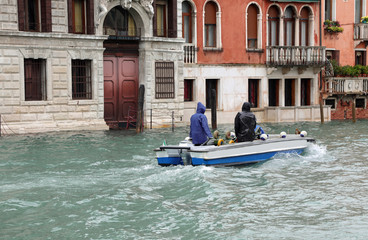 boat in the Grand Canal in Venice during high tide