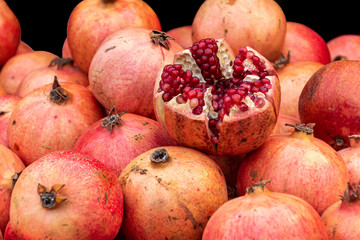 fresh pomegranates in an open market
