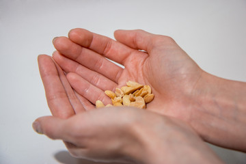 Palms holding peanuts