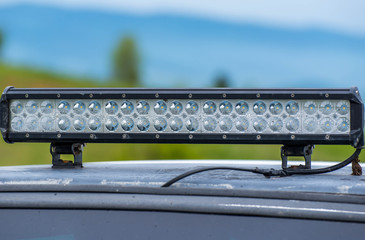 Steamed led bar on off road vehicle close up shot on a cloudy day.