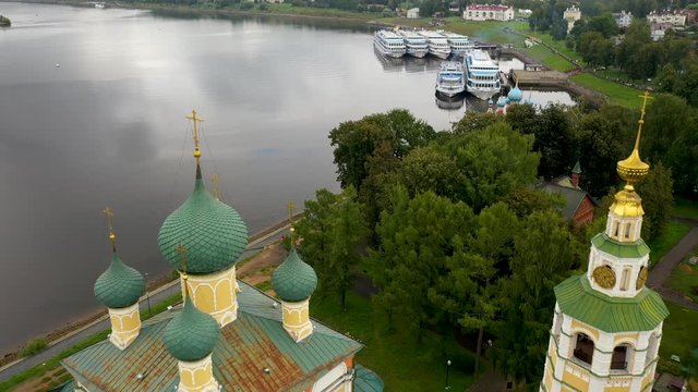 Uglich, Russia, flying a drone over a historic Church building, promenade and tourist steamers