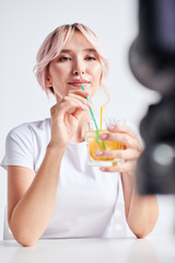 Woman sipping fresh water with straw