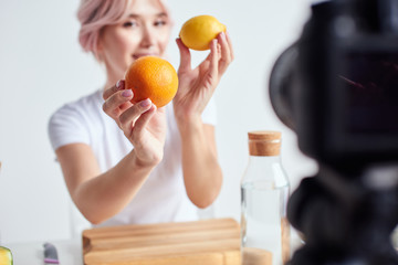 Woman holding fresh fruits in ahnds