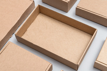 Set of different cardboard boxes on grey background, mock up, top view
