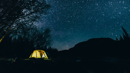 winter landscape with mountains. landscape with stars. man on the background of stars
