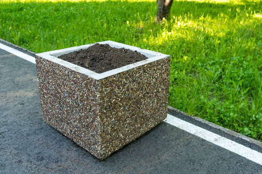 Square Concrete Flower Bed In The Park