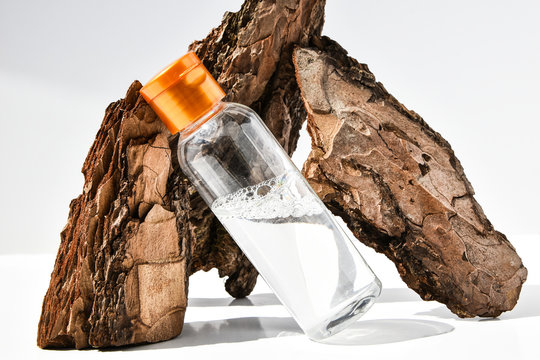 Perfume in tree bark with drops of water. texture. concept of freshness and naturalness. the aroma of wood and morning dew. autumn melancholy. copy space