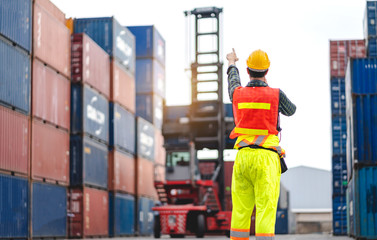 Professional engineer container cargo foreman in helmets working standing and checking stock into container for loading.logistic and business export
