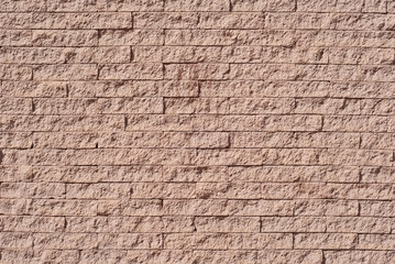Brick wall texture. Artistic plaster in the form of a brick.