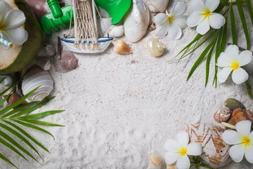 Gordijnen Shells and plumeria flowers on sand background, © kwanchaichaiudom
