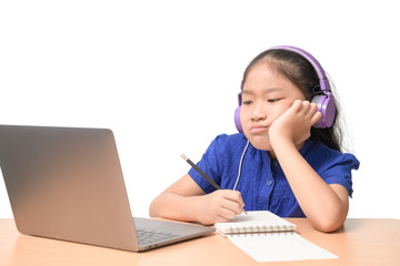School girl watching online education classes feeling bored and depressed at home.