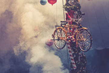 Christmas bicycle decoration with smoke as background.
