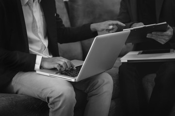  Business team meeting present.professional investor working with  Finance managers task. withlaptop smart phone and digital tablet in morning light
