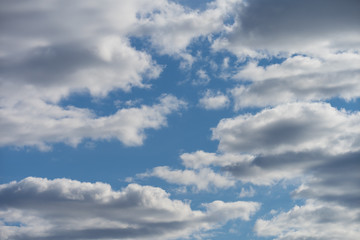Fototapeta na wymiar Blue sky with clouds and sun texture