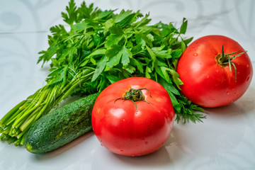 Fresh vegetables. parsley, dill, tomato on a white background.