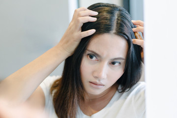 Woman serious hair loss problem for health care shampoo and beauty product concept, selective focus