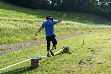 Men balancing on a slack line