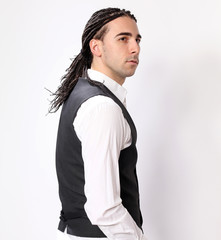 Stylish male model with afro braids posing in studio on isolated background. Style, trends, fashion...